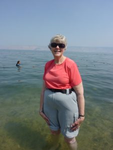 Janet wading in the Sea of Galilee